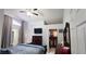 Primary bedroom featuring vaulted ceilings, walk-in closet and ensuite bathroom at 8207 Volusia Pl, Tampa, FL 33637