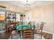 Elegant dining room featuring a stylish chandelier and decorative accents at 830 S Gulfview Blvd # 102, Clearwater Beach, FL 33767