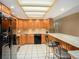 The kitchen offers a light-filled space with a sunlit skylight, modern appliances, and breakfast bar at 830 S Gulfview Blvd # 102, Clearwater Beach, FL 33767