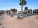 Community pool area with plenty of seating, tables, and chairs for relaxing in the sun at 830 S Gulfview Blvd # 102, Clearwater Beach, FL 33767