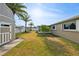 Backyard featuring mature landscaping and an exterior storage shed at 8417 Bay Pointe Dr, Tampa, FL 33615