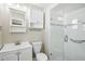 Bathroom features a glass-enclosed shower, modern sink, and updated fixtures at 8417 Bay Pointe Dr, Tampa, FL 33615