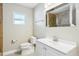 Bathroom features modern sink and mirror plus tiled shower at 8417 Bay Pointe Dr, Tampa, FL 33615