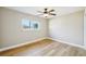 Comfortable bedroom with hardwood floors, a ceiling fan, and neutral paint at 8417 Bay Pointe Dr, Tampa, FL 33615
