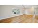 Bright, open living room features light wood floors, large window, and ceiling fan at 8417 Bay Pointe Dr, Tampa, FL 33615