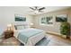 Cozy main bedroom features modern decor, a ceiling fan, and natural light at 8417 Bay Pointe Dr, Tampa, FL 33615
