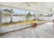 Enclosed sunroom offers tile flooring and screened windows at 8417 Bay Pointe Dr, Tampa, FL 33615