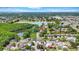 Scenic aerial view of a charming neighborhood with a tranquil lake, lush greenery, and well-maintained streets at 9050 Lake Place Ln, Tampa, FL 33634