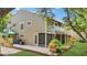 Two-story townhouse featuring a screened porch and white balcony at 9050 Lake Place Ln, Tampa, FL 33634