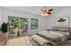 Bright and airy virtually staged bedroom with balcony access at 9050 Lake Place Ln, Tampa, FL 33634