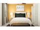 Inviting bedroom with a soft color palette, complemented by stylish lamps, and an attractive headboard at 9443 Raised Tulip Ln, Land O Lakes, FL 34637