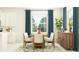Inviting dining room with a modern wooden table, chairs, and stylish décor at 9711 Minnow Ray Dr, Land O Lakes, FL 34638