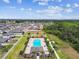An aerial shot shows a community pool and playground providing a central hub for recreation and social activities for residents at 1009 Wynnmere Walk Ave, Ruskin, FL 33570