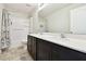 Bathroom featuring a double vanity with a white countertop and a shower-tub combo at 1009 Wynnmere Walk Ave, Ruskin, FL 33570