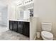 Bathroom featuring a double vanity with black cabinets and a white countertop at 1009 Wynnmere Walk Ave, Ruskin, FL 33570