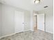 Neutral bedroom featuring tile flooring, two doors, and a ceiling light at 1009 Wynnmere Walk Ave, Ruskin, FL 33570