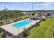 A community pool with sun loungers offers residents a serene spot for relaxation and recreation surrounded by green space at 1009 Wynnmere Walk Ave, Ruskin, FL 33570