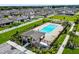 A community pool and playground are surrounded by neat landscaping, offering both leisure and fun in a well-maintained environment at 1009 Wynnmere Walk Ave, Ruskin, FL 33570