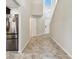 Bright entryway with soaring ceilings, stylish tile flooring, and views of the upper level at 1009 Wynnmere Walk Ave, Ruskin, FL 33570
