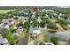 Aerial view of a community featuring lush landscaping and a serene pond at 10412 Tara Dr, Riverview, FL 33578