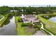 Aerial view of a home overlooking a tranquil pond at 10412 Tara Dr, Riverview, FL 33578