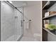 Modern bathroom featuring white marble shower and tiled floor at 10412 Tara Dr, Riverview, FL 33578