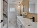 Bathroom features double sinks, modern mirrors, and beautiful marble finishes at 10412 Tara Dr, Riverview, FL 33578