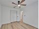 Bedroom featuring hardwood floors, closet space, and a ceiling fan at 10412 Tara Dr, Riverview, FL 33578