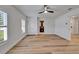 Bedroom with wood floor, closet, shuttered windows and bathroom en suite at 10412 Tara Dr, Riverview, FL 33578