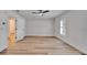 This bedroom includes wood-look flooring and natural light from shuttered windows at 10412 Tara Dr, Riverview, FL 33578