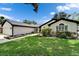 The house has a well-maintained lawn, mature landscaping, and inviting curb appeal at 10412 Tara Dr, Riverview, FL 33578
