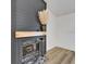 Close-up of fireplace with wood trim featuring pampas grass and marble hearth at 10412 Tara Dr, Riverview, FL 33578