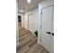 Bright hallway with wood floors and white doors at 10412 Tara Dr, Riverview, FL 33578