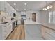 Bright kitchen with stainless appliances, island, and abundant storage at 10412 Tara Dr, Riverview, FL 33578