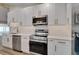 Kitchen area with modern appliances, sleek cabinetry, and modern fixtures at 10412 Tara Dr, Riverview, FL 33578