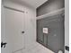 The laundry room with white tile floor and modern connections also has a wire rack for convenience at 10412 Tara Dr, Riverview, FL 33578