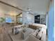 Bright and airy living room features modern furnishings, vaulted ceilings, and a neutral color palette at 10412 Tara Dr, Riverview, FL 33578