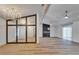 Spacious living room with wood flooring, fireplace, and large window offering ample natural light at 10412 Tara Dr, Riverview, FL 33578