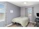 Bedroom with neutral color, bed, blinds, curtains, and desk setup at 10424 Laguna Plains Dr, Riverview, FL 33578
