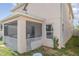 Exterior back view of home featuring screened in patio at 10424 Laguna Plains Dr, Riverview, FL 33578