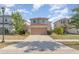 Charming two-story home featuring a wide driveway, a two car garage, and a landscaped front yard in a suburban neighborhood at 10424 Laguna Plains Dr, Riverview, FL 33578