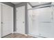 Bathroom with glass shower, white tile and neutral colored walls at 10424 Laguna Plains Dr, Riverview, FL 33578
