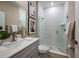 Modern bathroom featuring a glass-enclosed shower with textured walls and stylish fixtures at 12172 Cattleside Dr, Riverview, FL 33579