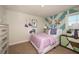Charming bedroom with pastel accents, whimsical artwork, and a bright, airy ambiance at 12172 Cattleside Dr, Riverview, FL 33579