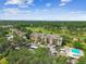 Scenic aerial view of a condo building surrounded by lush landscaping and golf course views at 13618 Greenfield Dr # 105, Tampa, FL 33618