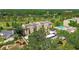 Scenic aerial view of a condo building with golf course, playground, and pool amenities at 13618 Greenfield Dr # 105, Tampa, FL 33618