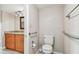 Bathroom featuring granite countertop vanity and grab bars by the toilet for easy access at 13618 Greenfield Dr # 105, Tampa, FL 33618