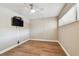 Bedroom with a ceiling fan and hardwood floors at 13618 Greenfield Dr # 105, Tampa, FL 33618