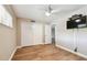 Bedroom featuring a closet, ceiling fan, and hardwood floors at 13618 Greenfield Dr # 105, Tampa, FL 33618