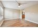 Bedroom featuring wood-look flooring, a window, and access to a bathroom at 13618 Greenfield Dr # 105, Tampa, FL 33618